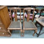 A pair of mid 20th century oak dining ch