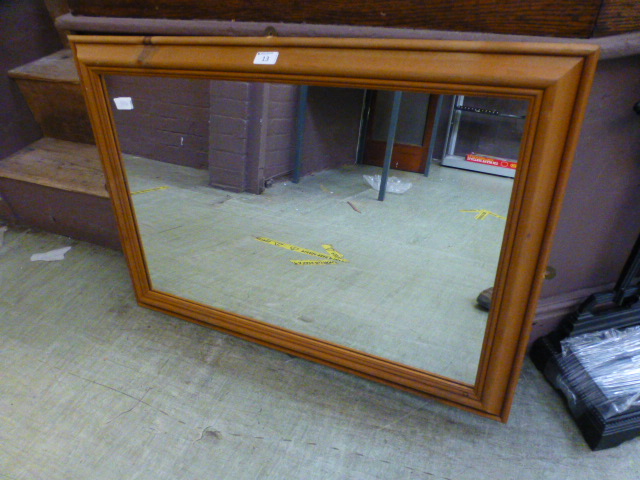 A pine framed rectangular mirror