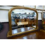 A reproduction gilt over mantle mirror,
