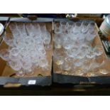 Two trays of cut glass drinking vessels