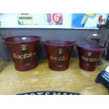 A set of three Coca Cola buckets