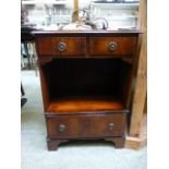 A reproduction mahogany cabinet having t