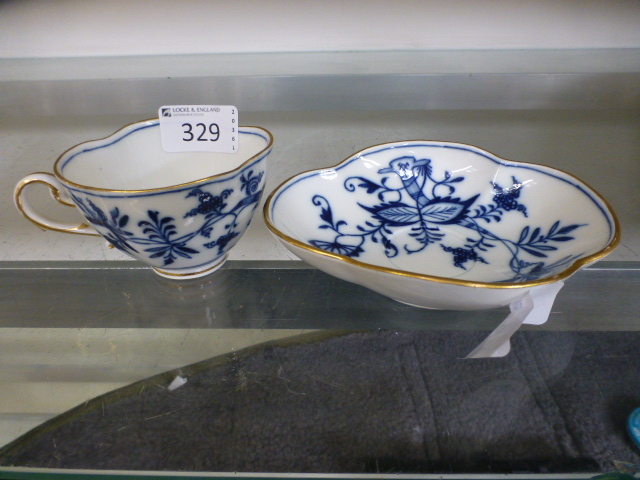 A blue and white Meissen cup and saucer