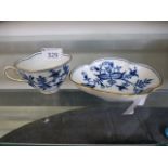 A blue and white Meissen cup and saucer