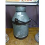 A small old milk churn