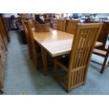 A modern oak extending dining table toge