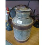 A small old milk churn