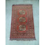 An eastern red ground rug