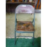 A painted metal folding chair 'The Roost