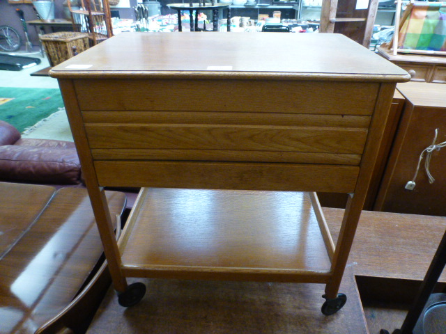 A mid 20th century oak hinge top sewing