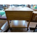 A mid 20th century oak hinge top sewing