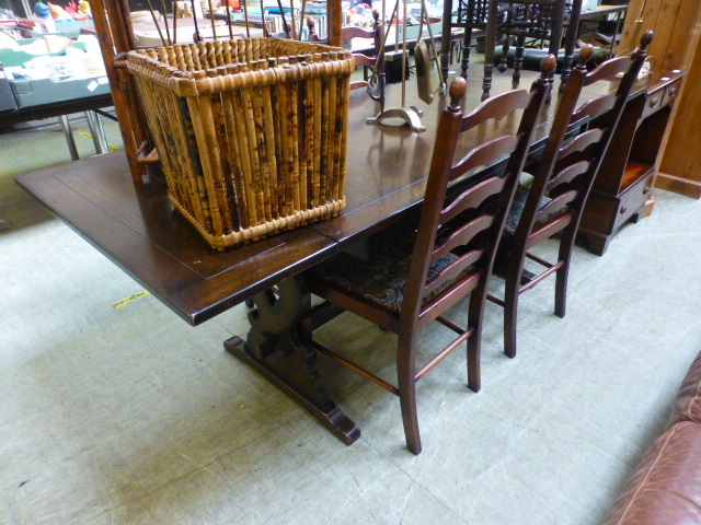 A mid-20th century oak drawer leaf table