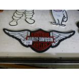 A Harley Davidson wing sign