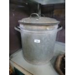 A galvanized twin handled slop bucket