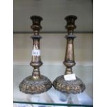 A pair of silver plated candlesticks