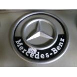 A Mercedes-Benz sign