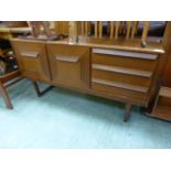 A mid-20th century teak sideboard having