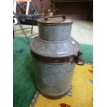 A medium old milk churn