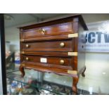 A large wooden jewellery box having lift