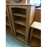 A modern pine open bookcase