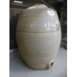 A four gallon stoneware water barrel