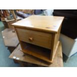 A pine bedside cabinet with single drawe