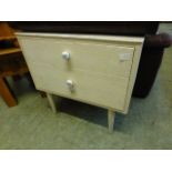 A two drawer chest on tapering legs