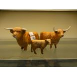 Three Beswick models of highland cattle