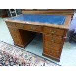 An early 20th century pedestal desk with