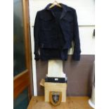 A navy blue military uniform along with