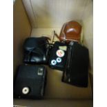 A box of assorted cameras