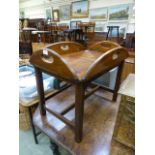 A reproduction walnut butler's tray on s