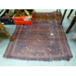 A hand woven red ground Turkish rug (A/F