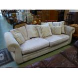 A modern three seat sofa upholstered in