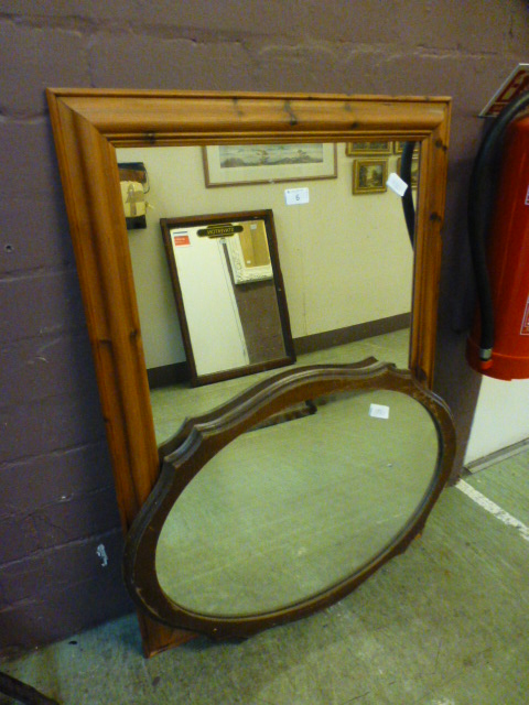 A pine framed rectangular mirror along w