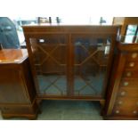 A modern yew veneered display cabinet, t