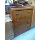 A mid-20th century teak chest of five lo