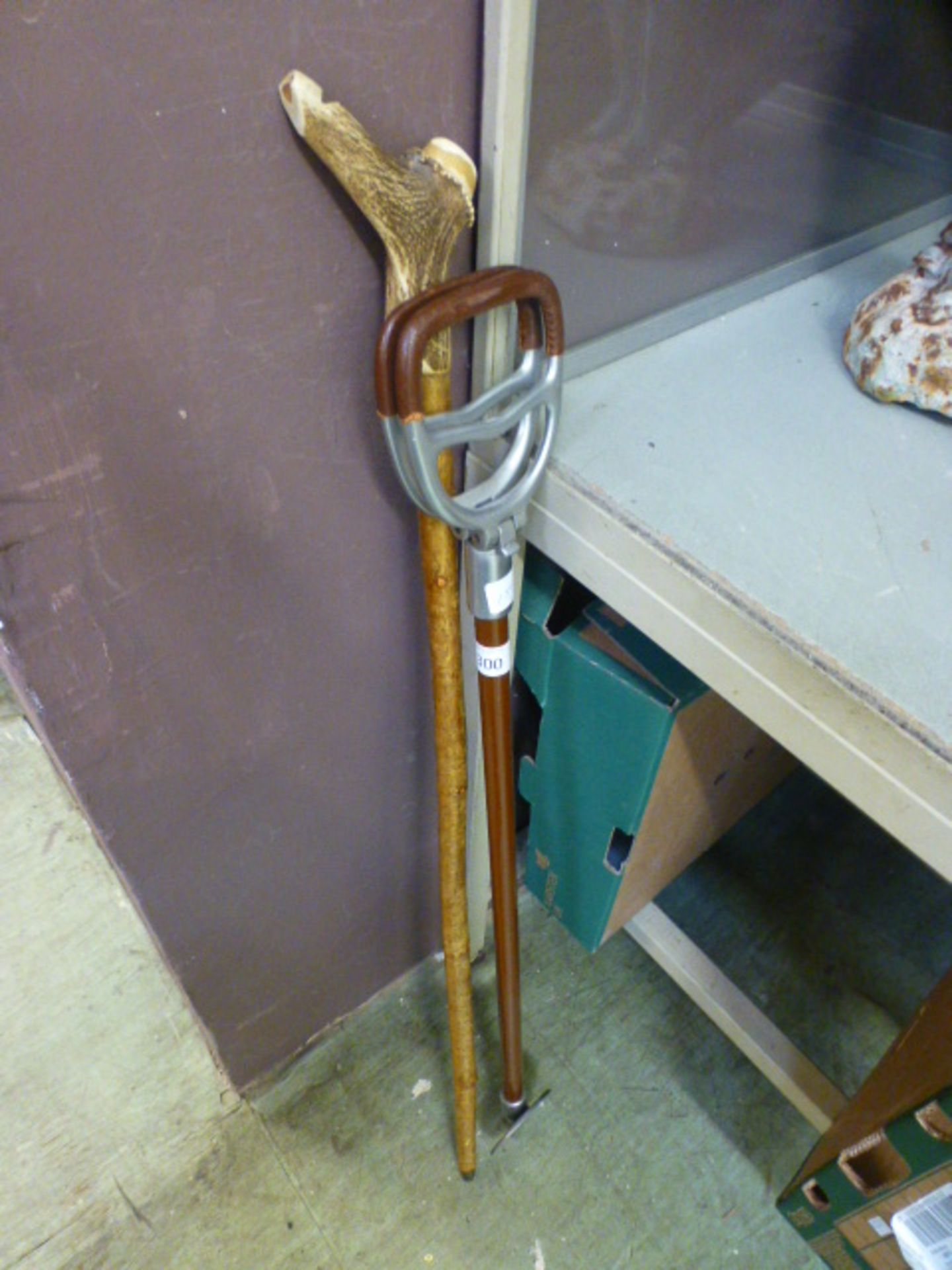 A shooting stick together with an antler
