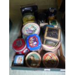 A tray containing a quantity of old tins