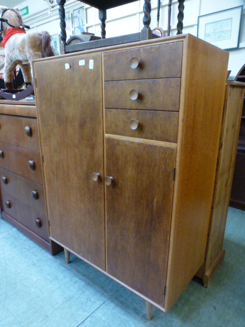 A mid-20th century oak veneered gentlema