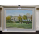 A framed oil on on canvas of horses outs