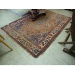 A handwoven Persian rug the triple line