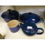 A LeCreuset teapot and pot together with