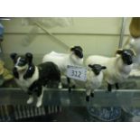 Three Beswick sheep together with a Besw