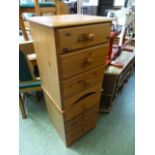 A pair of pine bedside three drawer ches