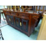 A Chinese padauk sideboard, the top over