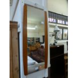 A mid-20th century teak framed mirror