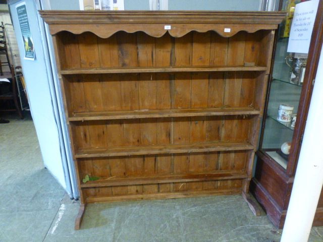 A pine plate rack, the cornice over open