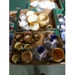 Two trays of Wade jugs, decanters, bowls