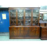 A reproduction mahogany bookcase, the fo